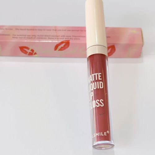 Matte liquid lip gloss with packaging on a white background